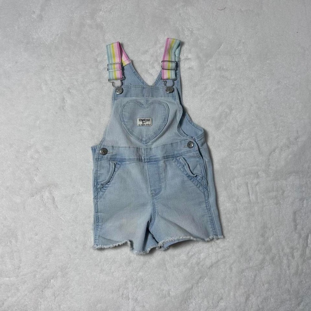 Blue denim shorts overalls with heart detail and rainbow straps. Size: 2 years